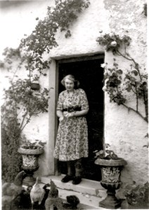Lucy Butters feeding the hens at Springbank Cottage.